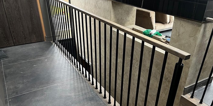 metal rods and oak balustrade in commercial building