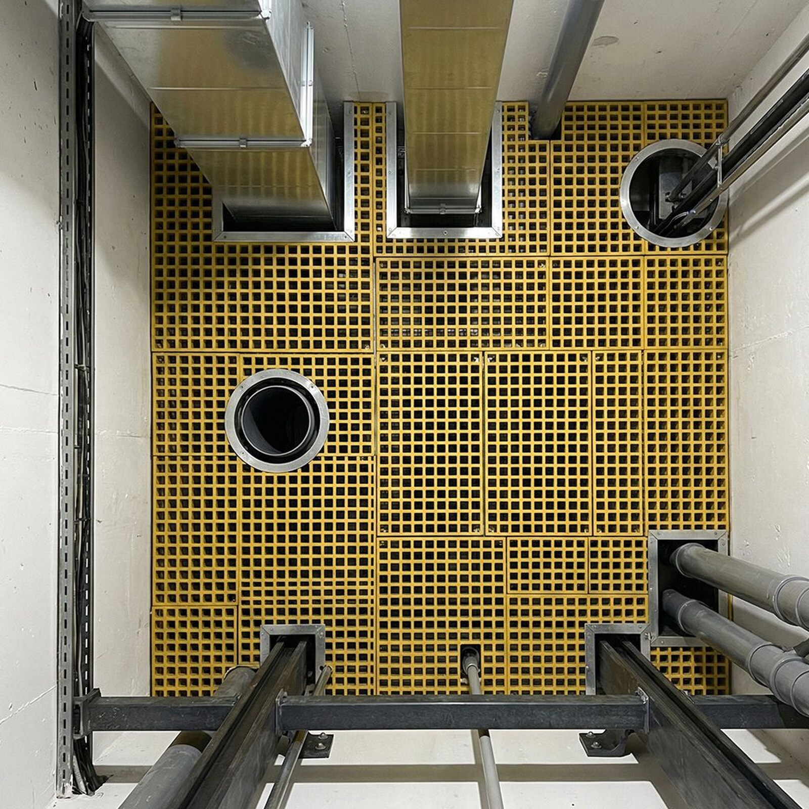 GRP grating cut around duct and pipe penetrations